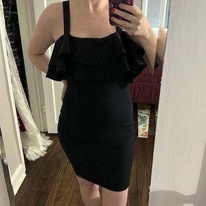 Form fitting navy dress with ruffle lining on top